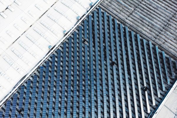 Unrecognizable industrial area with a field of solar panels